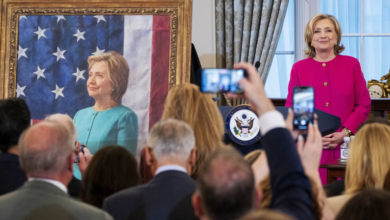 Former Secretary of State Hillary Rodham Clinton reacts as her portrait is unveiled, during a ceremony, Tuesday, Sept. 26, 2023, at the State Department in Washington. (AP Photo/Jacquelyn Martin)