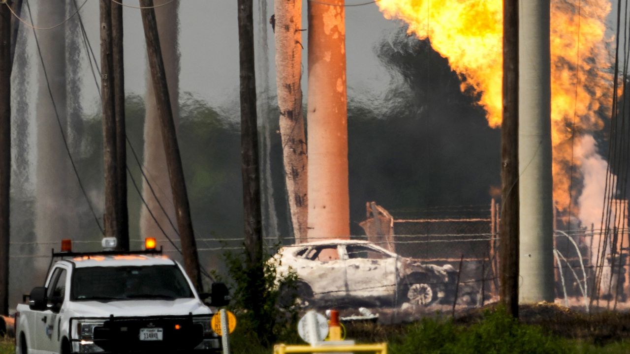 A massive pipeline fire burns after a vehicle drove through a fence along a parking lot and struck an above-ground valve near Spencer Highway and Summerton on Monday, Sept. 16, 2024, in La Porte, Texas. (Brett Coomer/Houston Chronicle via AP)