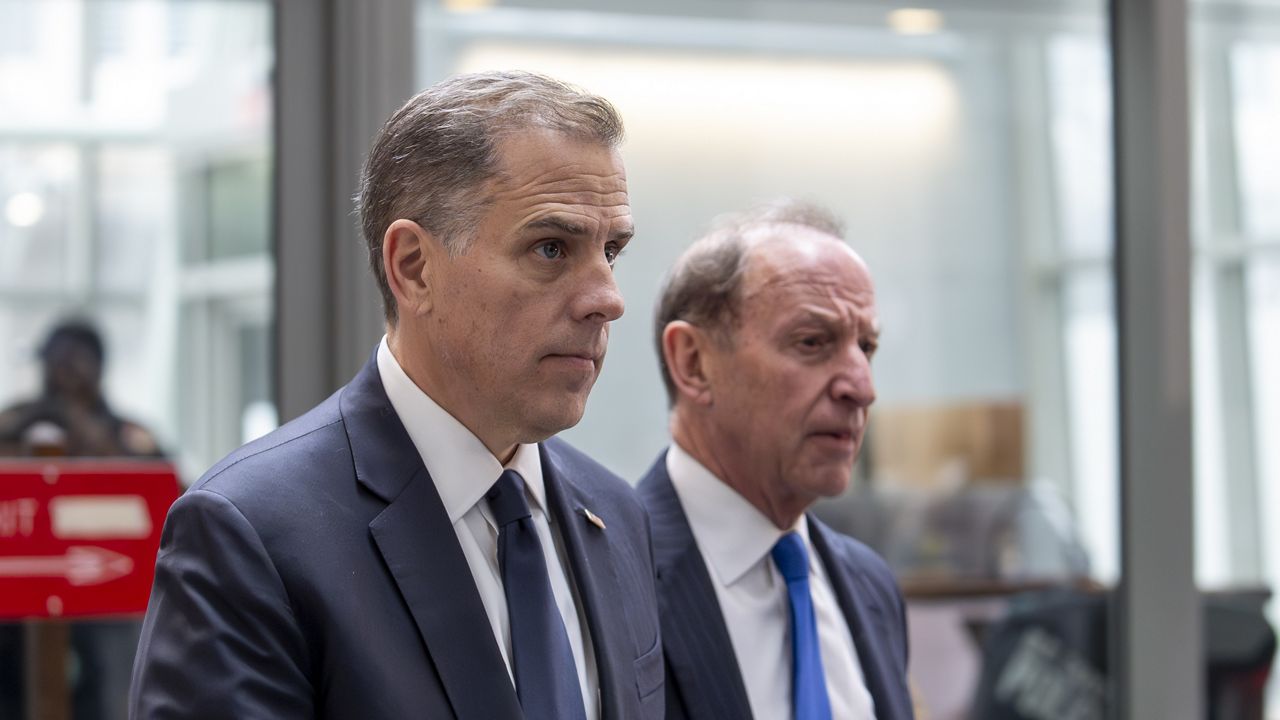 Hunter Biden, left, son of President Joe Biden, arrives with attorney Abbe Lowell at the O'Neill House Office Building for a closed-door deposition in a Republican-led investigation into the Biden family, on Capitol Hill in Washington, Wednesday, Feb. 28, 2024. (AP Photo/J. Scott Applewhite)