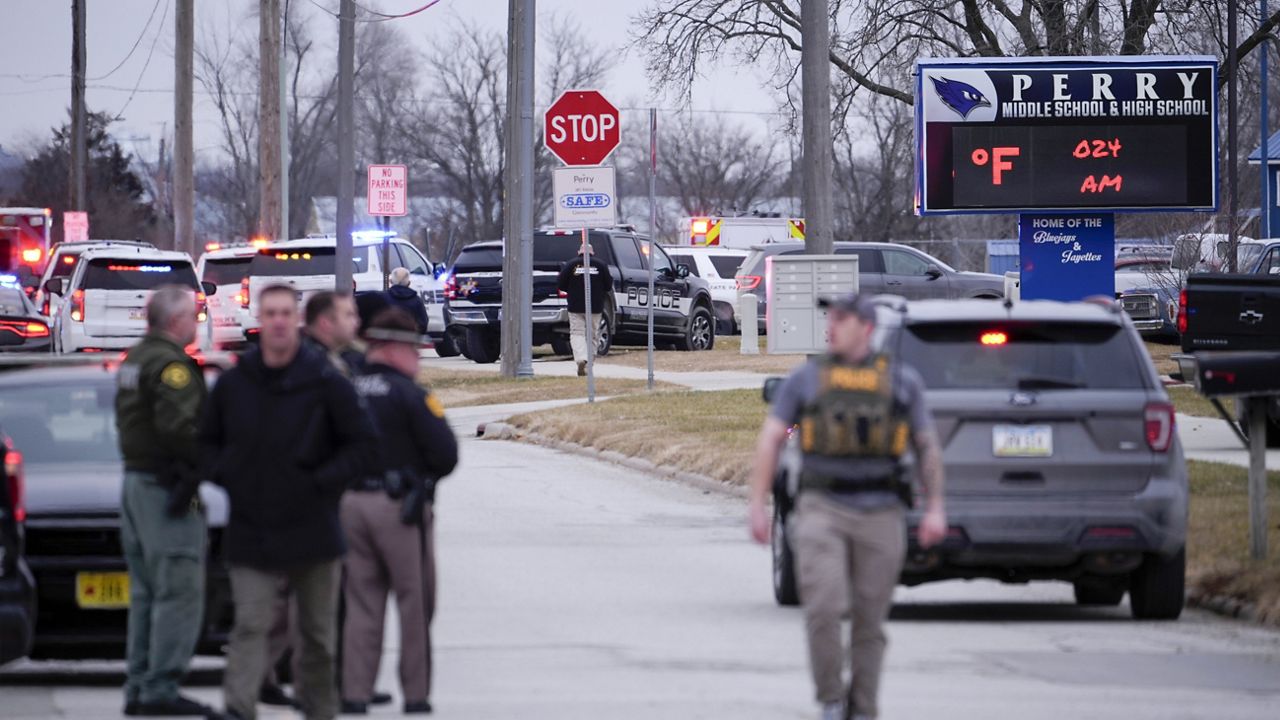 Police respond to Perry High School in Perry, Iowa., Thursday, Jan. 4, 2024. (AP Photo/Andrew Harnik)