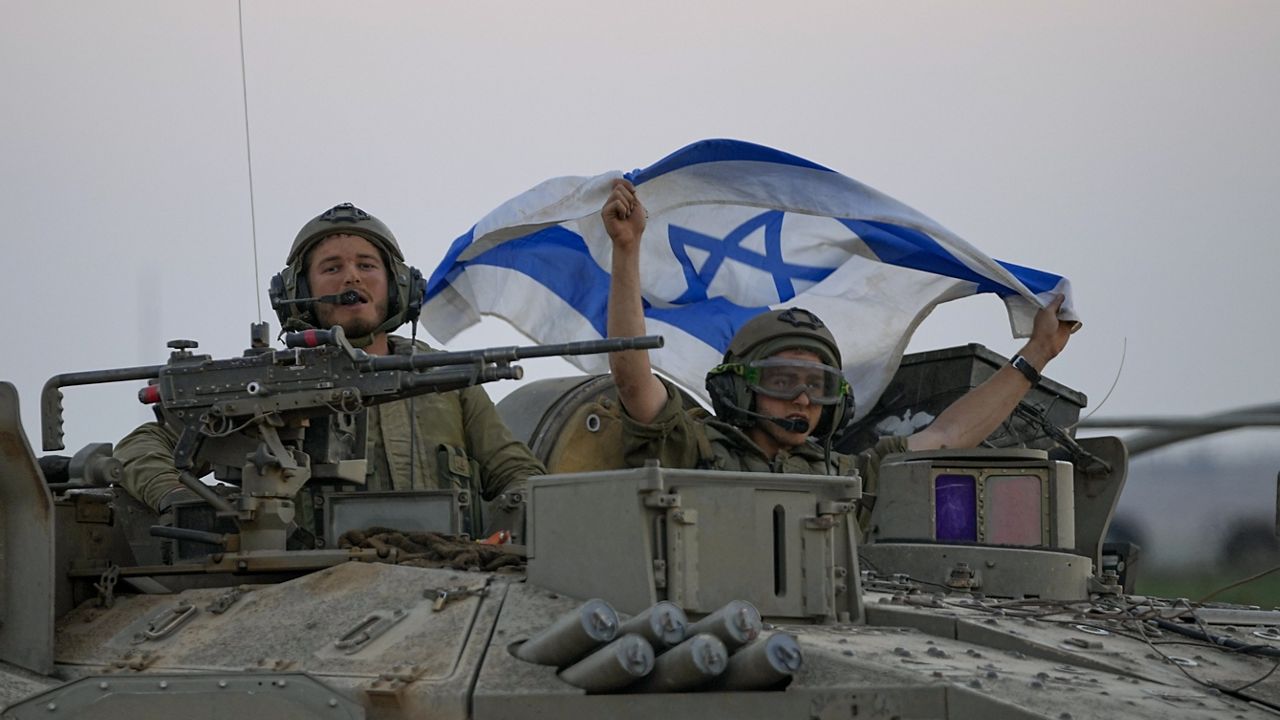 Israeli tanks head towards the Gaza Strip border in southern Israel on Thursday, Oct.12, 2023. (AP Photo/Ohad Zwigenberg)