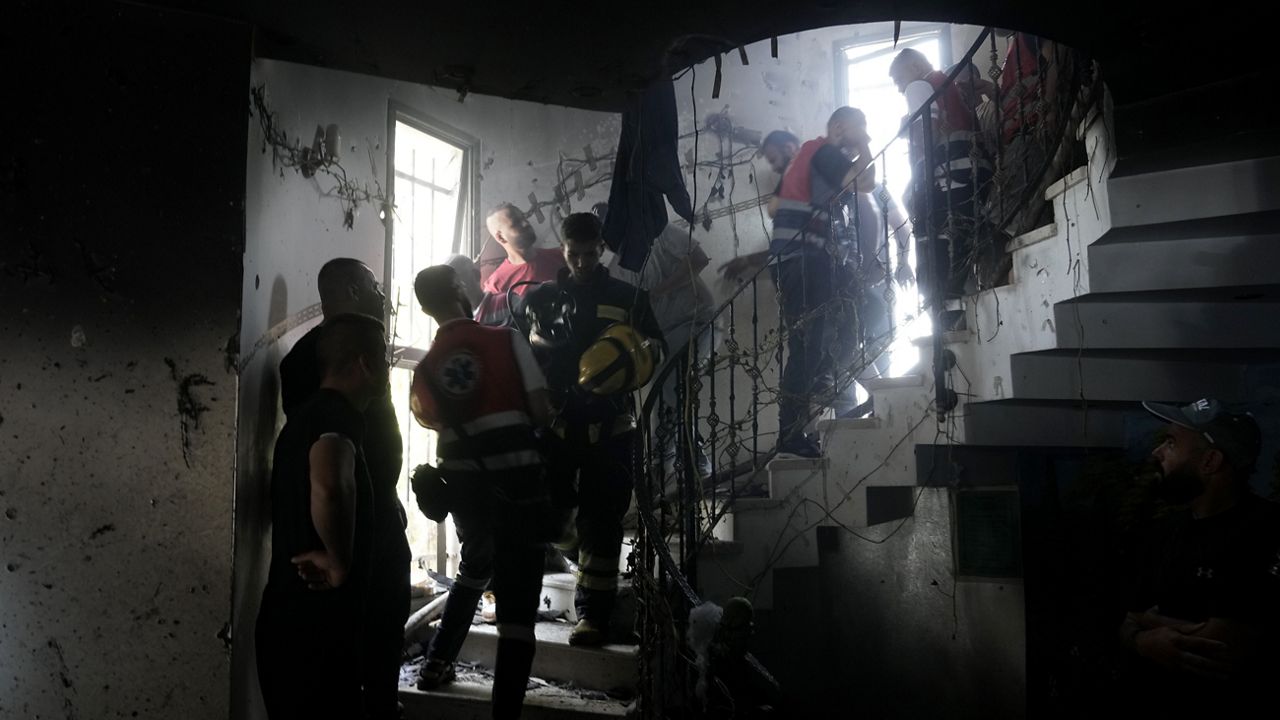 Palestinian first responders work inside a home destroyed in an Israeli military operation in the West Bank city of Jenin, Friday, July 5, 2024. (AP Photo/Majdi Mohammed)