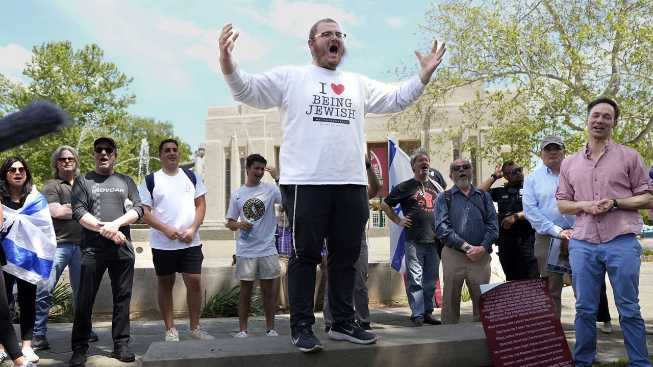 Rabbi Levi Cunin, with Chabad on Campus, speaks during a pro-Israel rally at Indiana University in Bloomington, Ind., Thursday, May 2, 2024. (AP Photo/AJ Mast)