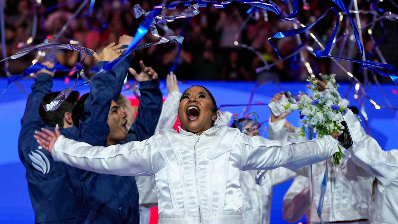 Jordan Chiles celebrates after she was named to the 2024 Olympic team at the United States Gymnastics Olympic Trials on Sunday, June 30, 2024, in Minneapolis. (AP Photo/Charlie Riedel)