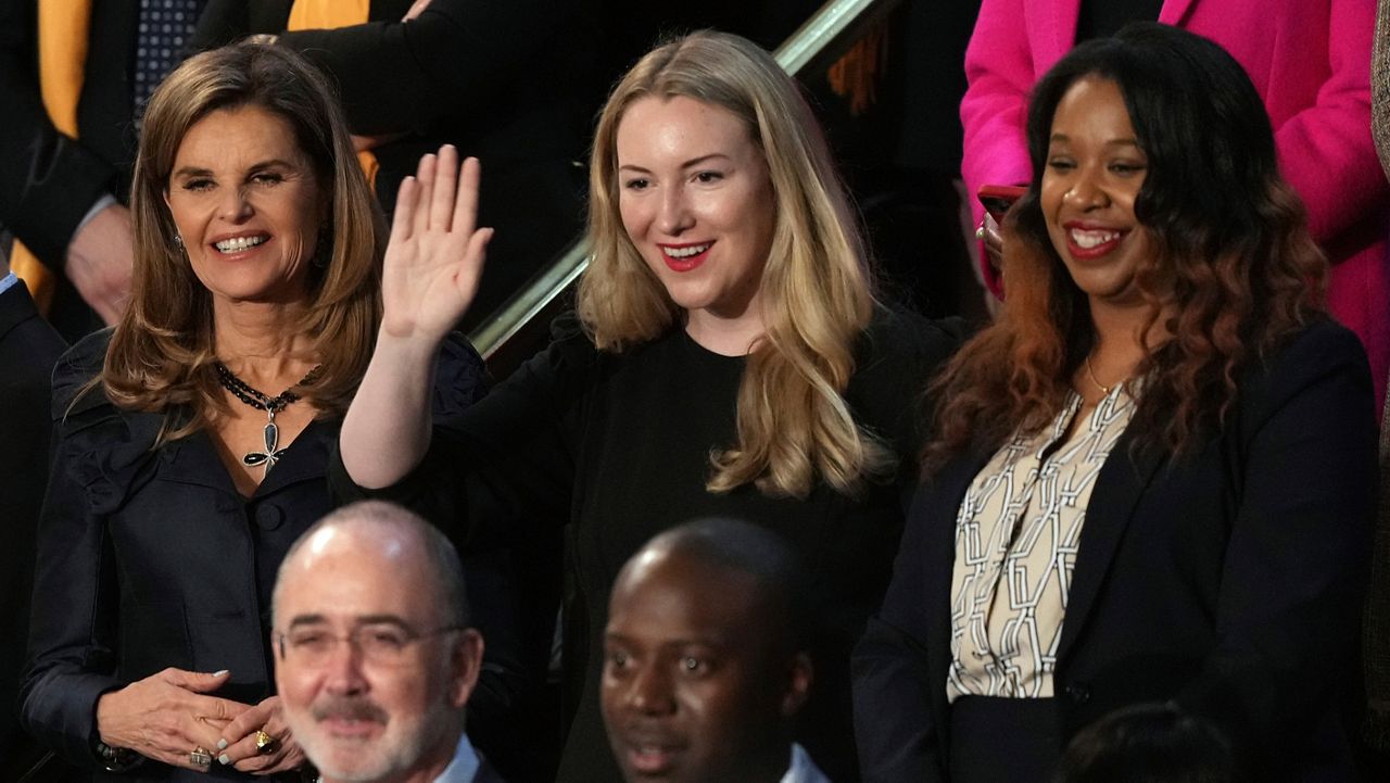 Maria Shriver, left, Kate Cox, of Dallas and Latorya Beasley of Birmingham, Ala., stand before President Joe Biden delivers the State of the Union address to a joint session of Congress at the U.S. Capitol, Thursday March 7, 2024, in Washington. (AP Photo/Andrew Harnik)