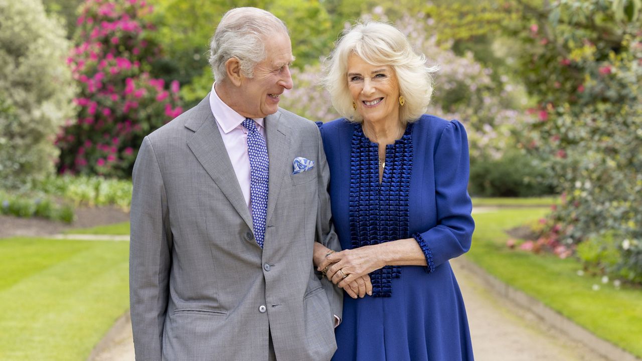 Britain's King Charles III and Queen Camilla stand in Buckingham Palace Gardens on Wednesday April 10, 2024, the day after their 19th wedding anniversary. (Millie Pilkington/Buckingham Palace via AP)