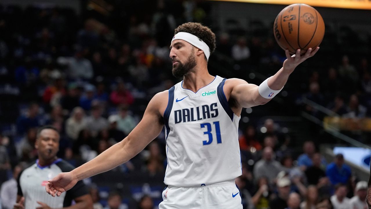 Dallas Mavericks guard Klay Thompson (31) handles the ball during the first half of a preseason NBA basketball game against the Milwaukee Bucks Thursday, Oct. 17, 2024, in Dallas. (AP Photo/LM Otero)