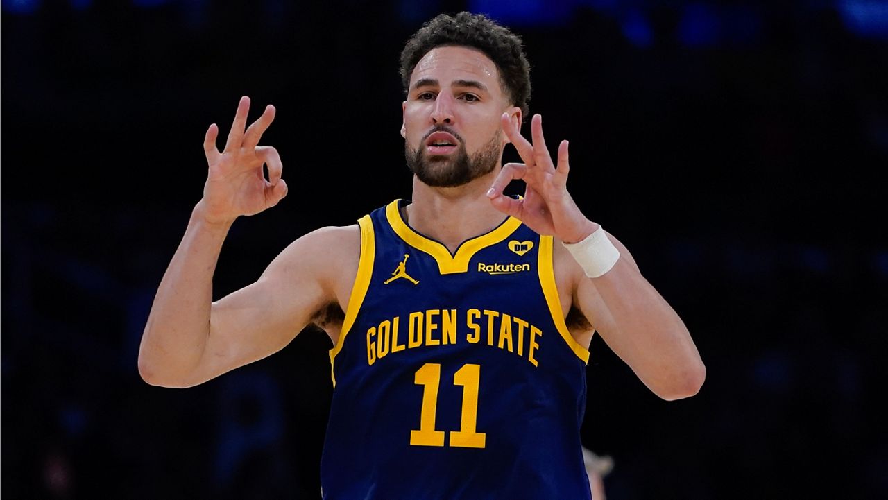 Golden State Warriors guard Klay Thompson gestures after making a 3-point basket against the Los Angeles Lakers during the second half of an NBA basketball game Tuesday, April 9, 2024, in Los Angeles. (AP Photo/Ryan Sun)