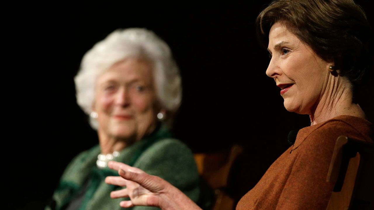 Former first ladies Barbara Bush, left, and Laura Bush, right, take part in the Enduring Legacies of America's First Ladies conference Thursday, Nov. 15, 2012, in Austin, Texas. (AP Photo/David J. Phillip)