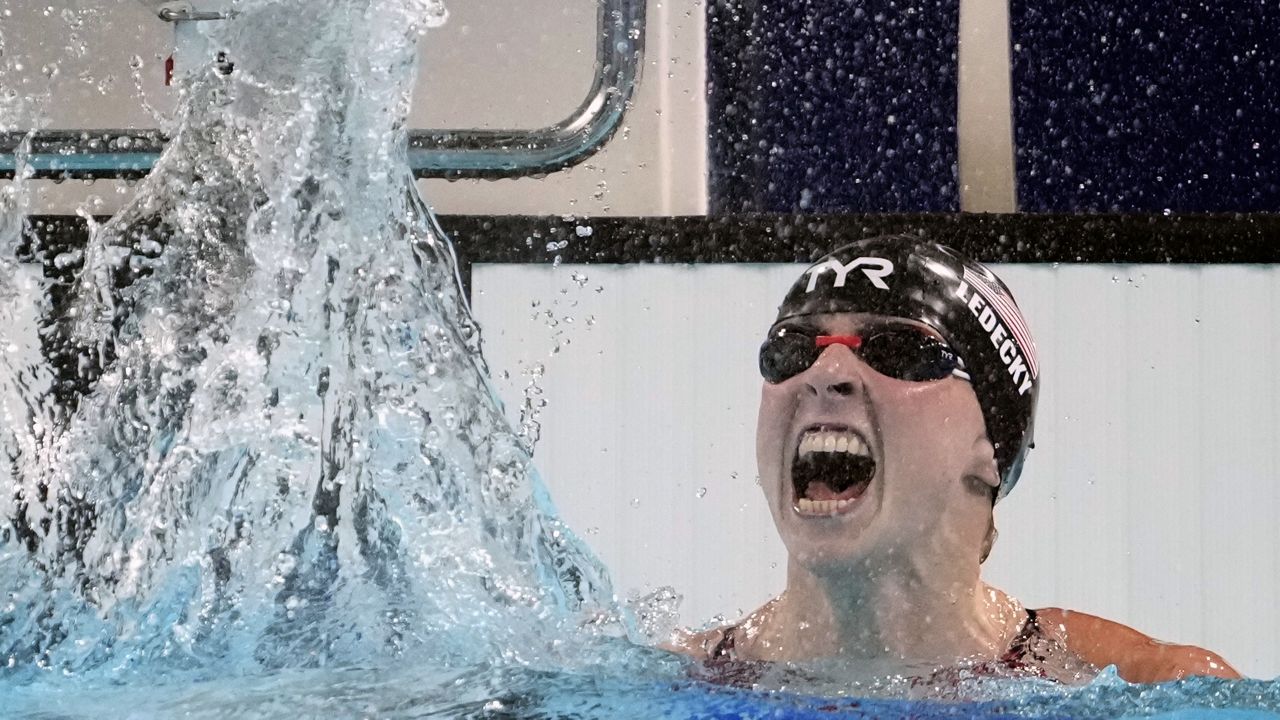 Katie Ledecky, of the United States, celebrates after winning the women's 1500-meter freestyle final at the 2024 Summer Olympics, Wednesday, July 31, 2024, in Nanterre, France. (AP Photo/Matthias Schrader)