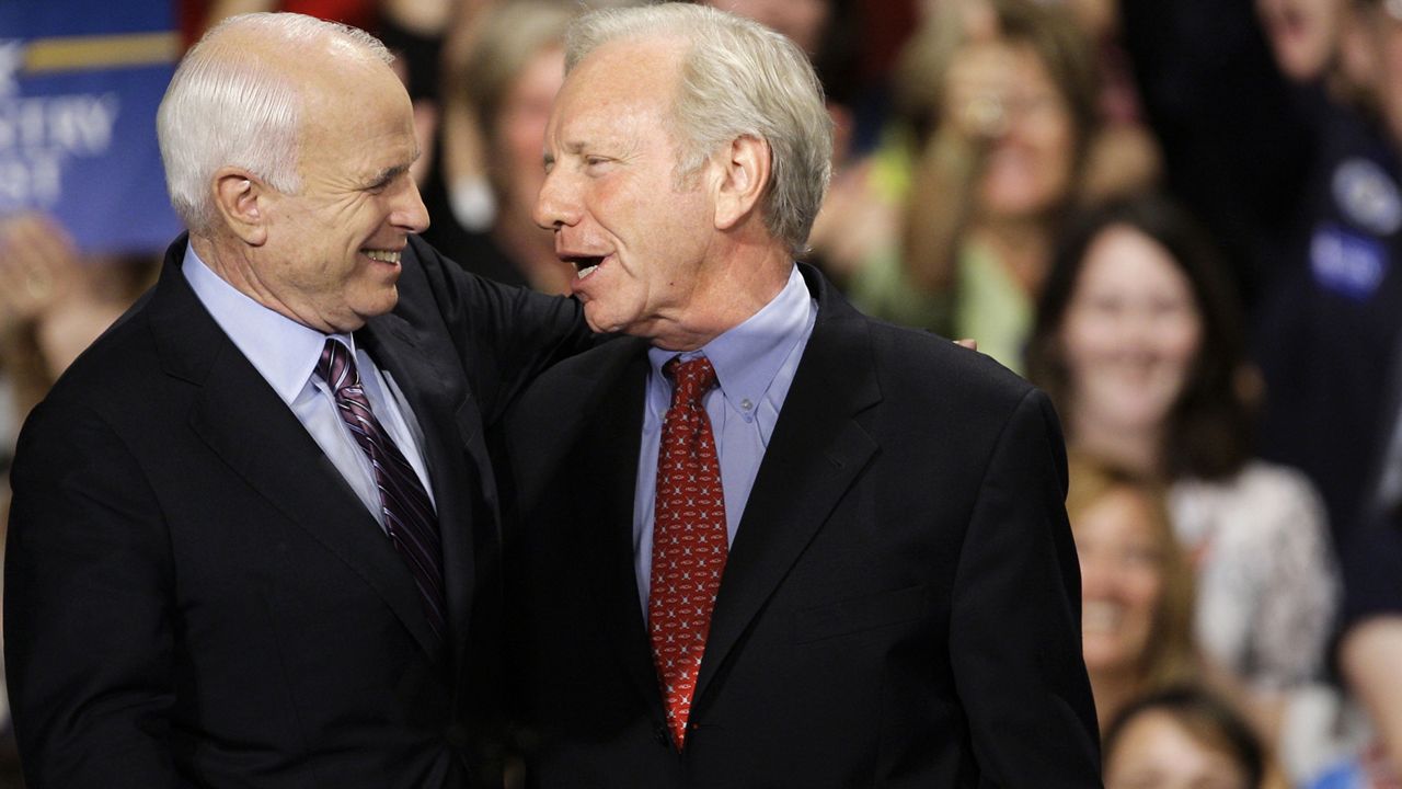 Republican presidential candidate Sen. John McCain, R-Ariz., is seen on stage with Sen. Joe Leiberman during a rally in Downingtown, Pa., Thursday, Oct. 16, 2008. (AP Photo/Matt Rourke)