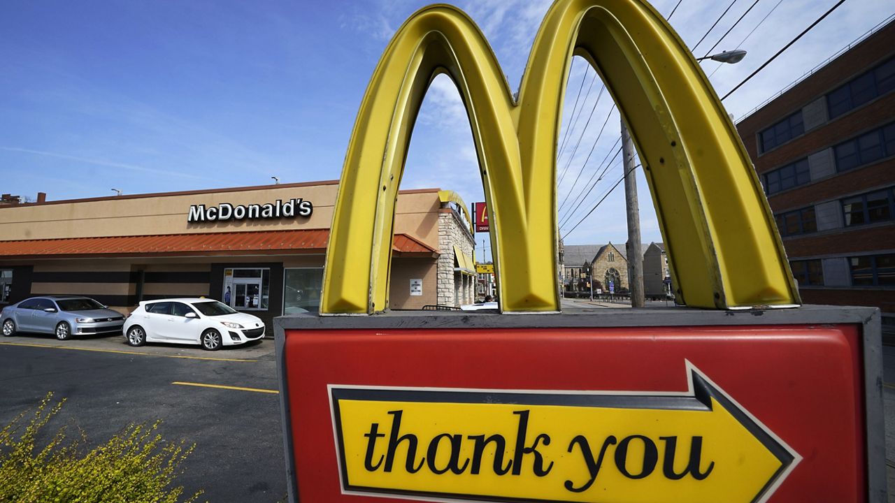 A sign is shown in front of a McDonald's restaurant. (AP Photo/Gene J. Puskar)