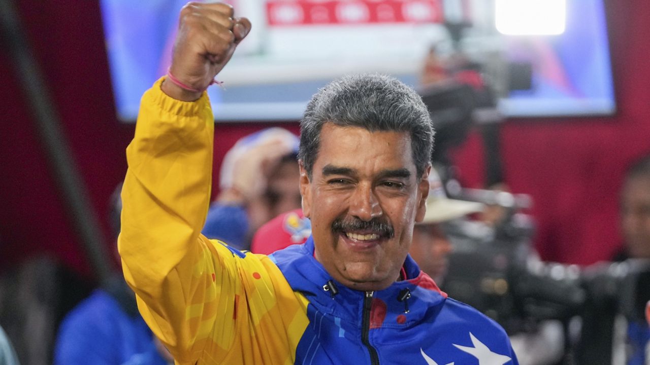 President Nicolas Maduro addresses supporters after electoral authorities declared him the winner of the presidential election in Caracas, Venezuela, Monday, July 29, 2024. (AP Photo/Fernando Vergara)