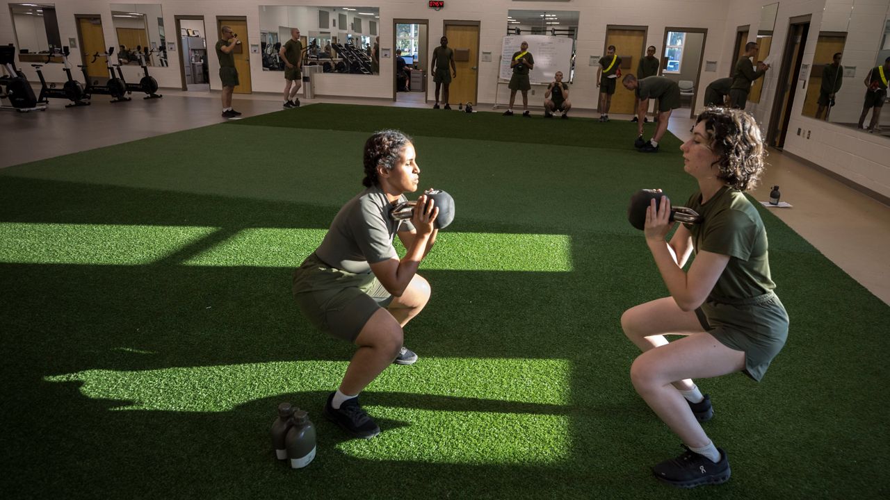 The Marines are moving gradually and sometimes reluctantly to integrate  women and men in boot camp