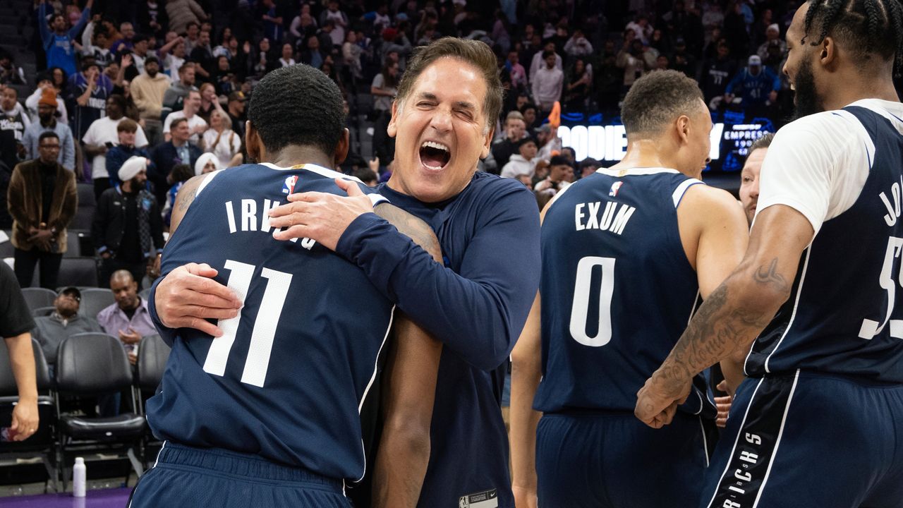 Mark Cuban embraces Dallas Mavericks guard Kyrie Irving after the Mavericks defeated the Sacramento Kings in an NBA basketball game in Sacramento, Calif., Friday, March 29, 2024. (AP Photo/José Luis Villegas)