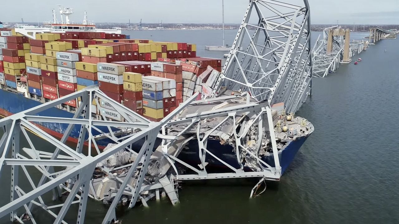 In this image taken from video released by the National Transportation and Safety Board, the cargo ship Dali is stuck under part of the structure of the Francis Scott Key Bridge after the ship hit the bridge, Tuesday, March 26, 2024, in Baltimore. (NTSB via AP)