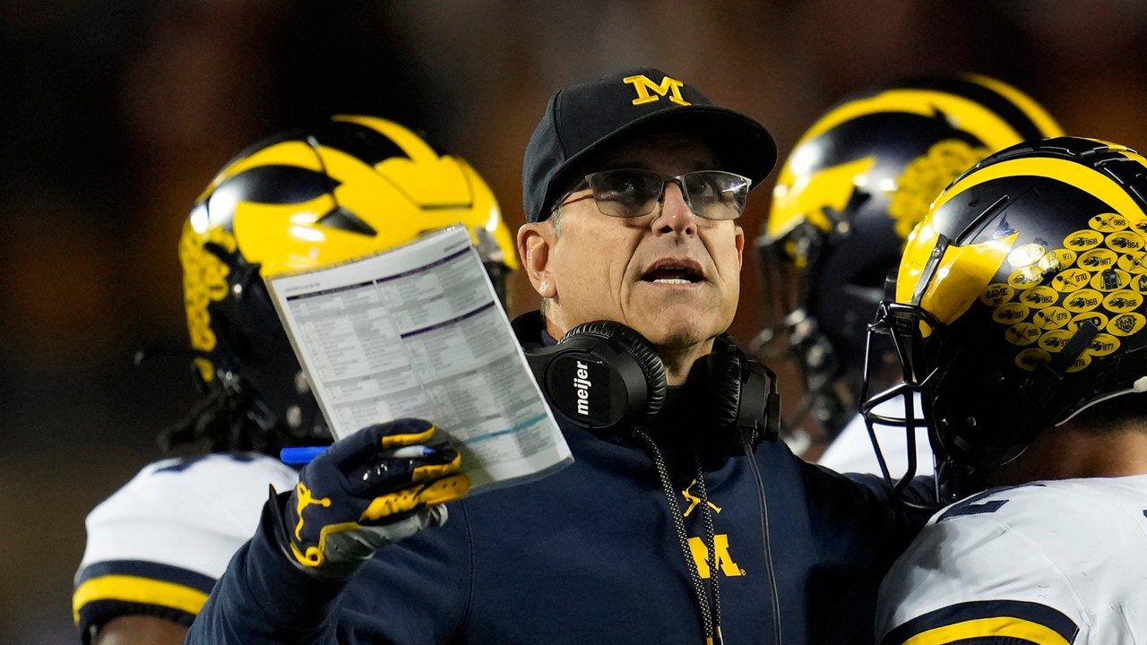 Michigan head coach Jim Harbaugh stands on the field during the first half of an NCAA college football game against Minnesota Saturday, Oct. 7, 2023, in Minneapolis. (AP Photo/Abbie Parr, File)