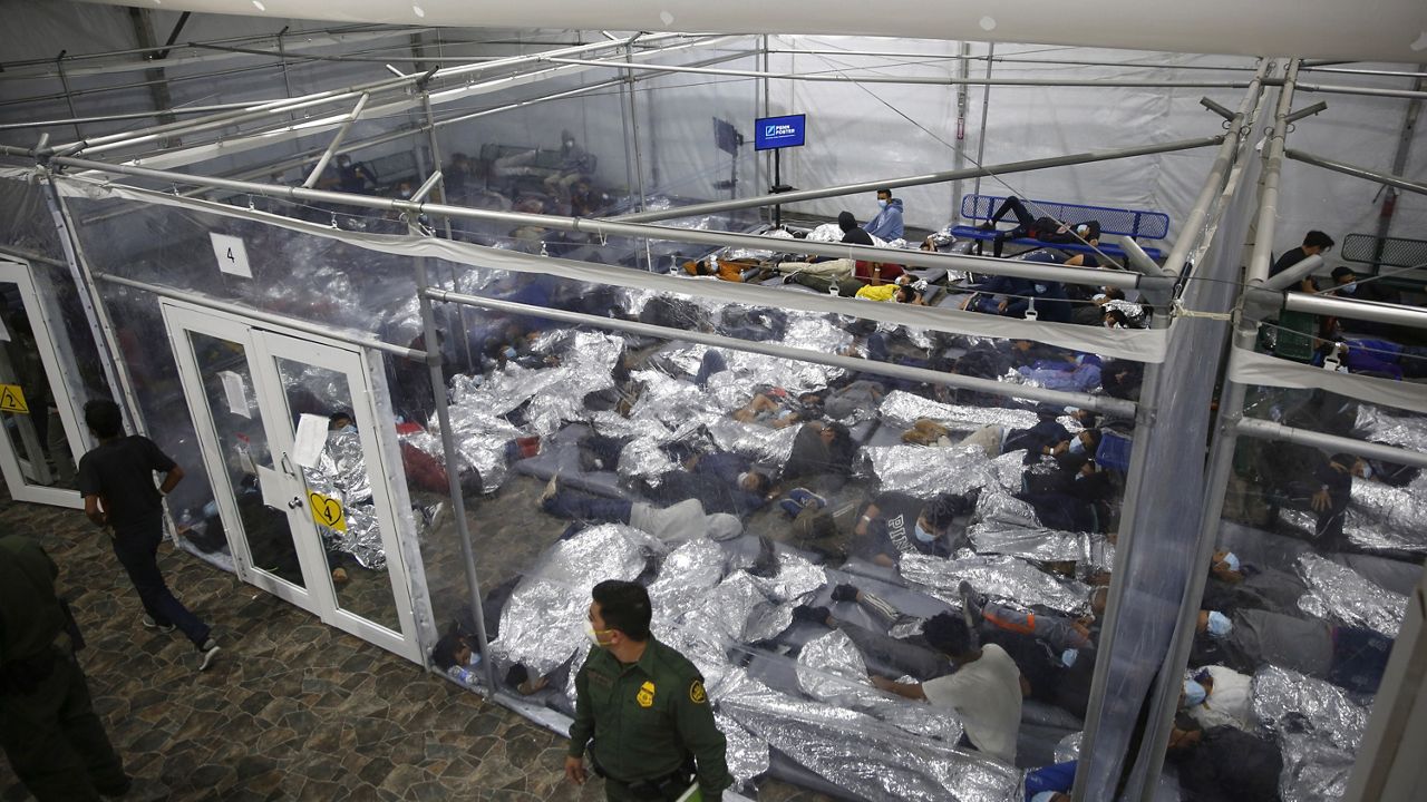  In this March 30, 2021, file photo, young minors lie inside a pod at the Donna Department of Homeland Security holding facility, the main detention center for unaccompanied children in the Rio Grande Valley run by U.S. Customs and Border Protection (CBP), in Donna, Texas. (AP Photo/Dario Lopez-Mills, Pool, File)