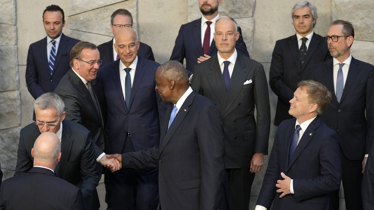 United States Secretary of Defense Lloyd Austin, front center, shakes hands with Germany's Defense Minister Boris Pistorius, center row left, during a group photo of NATO defense ministers at NATO headquarters in Brussels, Friday, June 14, 2024. (AP Photo/Virginia Mayo)