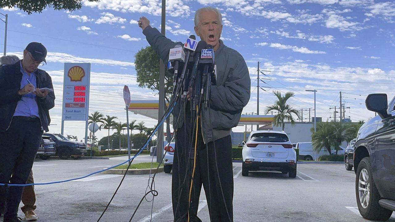 Former Trump White House official Peter Navarro speaks to reporters before he heads to prison, Tuesday, March 19, 2024 in Miami, to begin serving his sentence for refusing to cooperate with a congressional investigation into the Jan. 6, 2021, attack on the U.S. Capitol. (AP Photos/Adriana Gomez Licon)