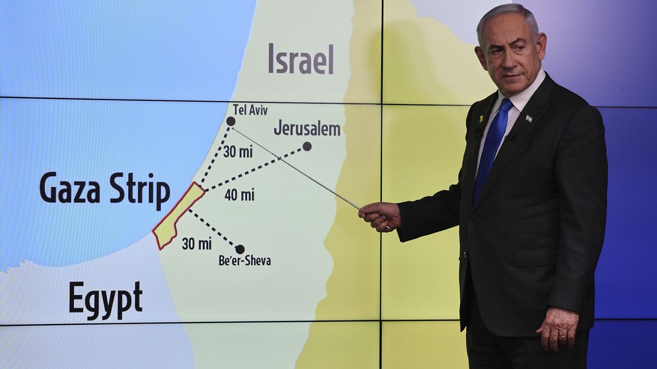 Israeli Prime Minister Benjamin Netanyahu gestures in front of a map during a press conference at the Government Press office in Jerusalem, Wednesday, Sept. 4, 2024. (Abir Sultan/Pool via AP)