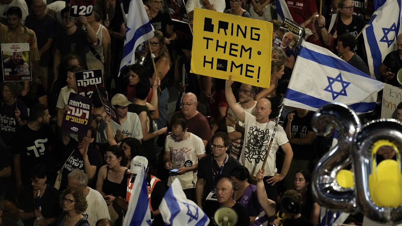 People protest against Israeli Prime Minister Benjamin Netanyahu's government and call for the release of hostages held in the Gaza Strip by the Hamas militant group, in Tel Aviv, Israel, Saturday, June 22, 2024. (AP Photo/Leo Correa)