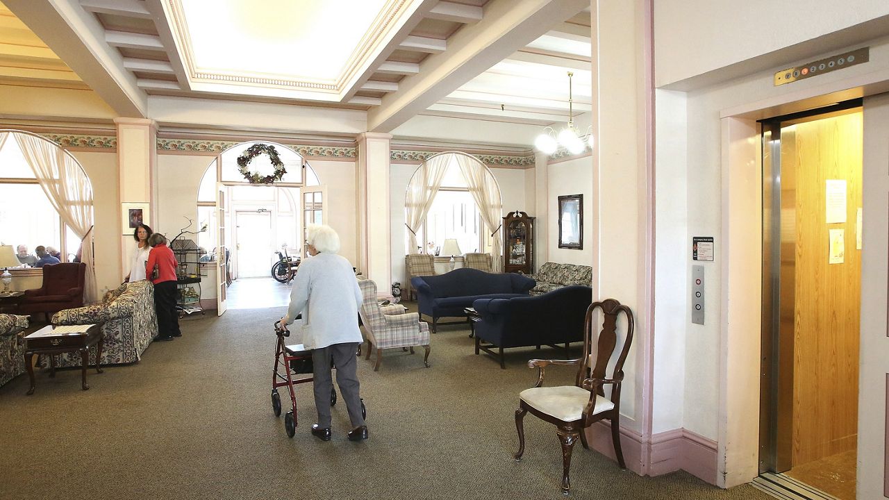 Bret Harte Retirement Inn residents make their way down to the dining room for lunch, May 6, 2020, in Grass Valley, Calif. (Elias Funez/The Union via AP)