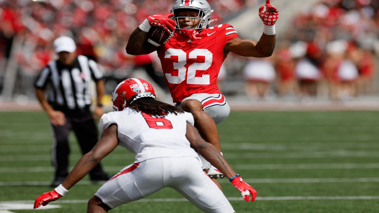 Ohio State running back TreVeyon Henderson, top, tries to hurdle Youngstown State defensive back Ezekiel Blake during the first half of an NCAA college football game Saturday, Sept. 9, 2023, in Columbus, Ohio. (AP Photo/Jay LaPrete)