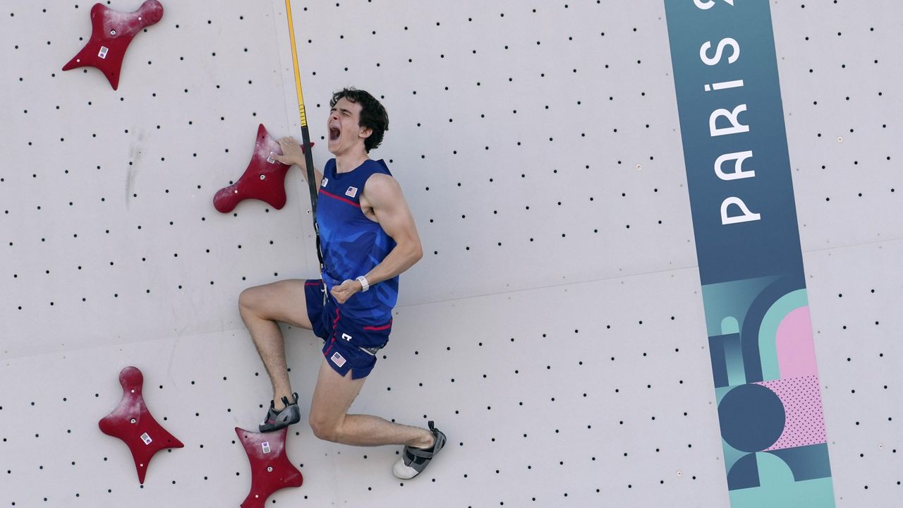 Sam Watson of the United States reacts as he competes in the men's speed, qualification elimination heats, during the sport climbing competition at the 2024 Summer Olympics, Tuesday, Aug. 6, 2024, in Le Bourget, France. (AP Photo/Tsvangirayi Mukwazhi)