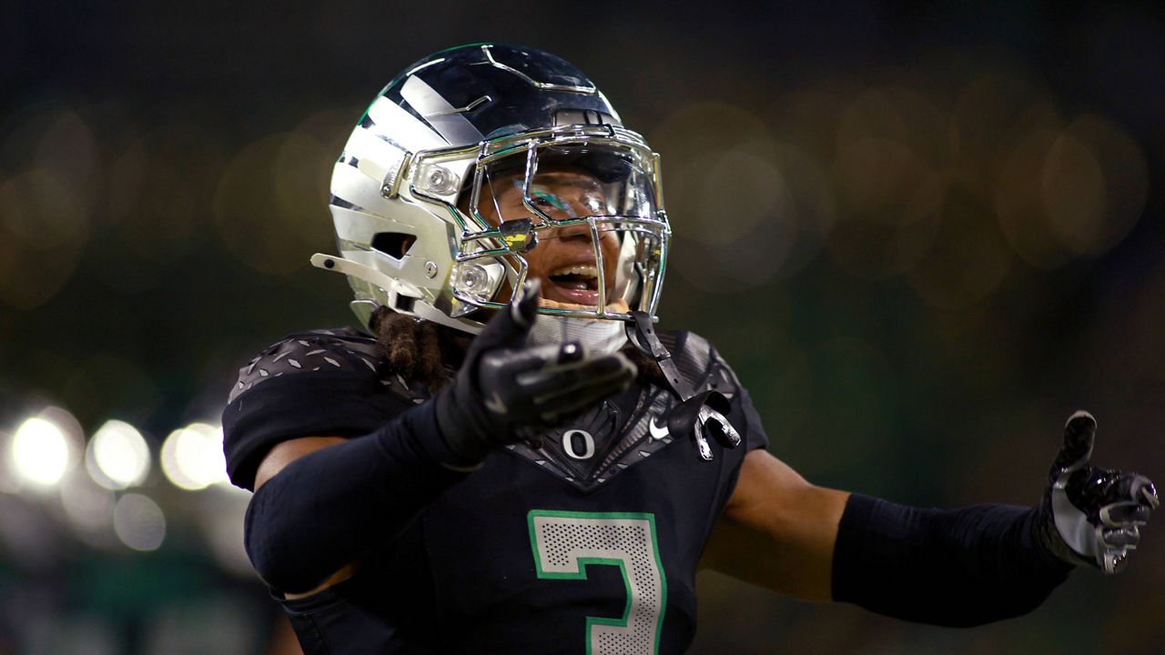 Oregon defensive back Brandon Johnson (3) rallies the crowd during an NCAA college football game, Saturday, Nov. 30, 2024, in Eugene, Ore. (AP Photo/Lydia Ely)