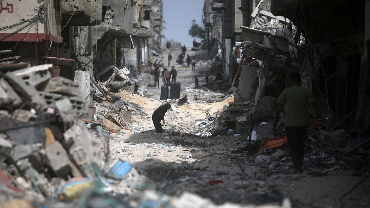 Palestinians visit their destroyed homes after Israeli forces left Khan Younis, Gaza Strip, Wednesday, March 6, 2024. (AP Photo/Mohammed Dahman)