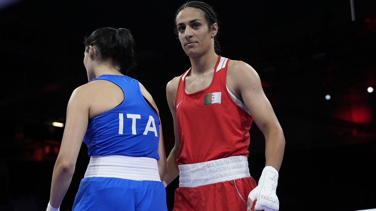 Boxer who had gender test issue wins first Olympic fight