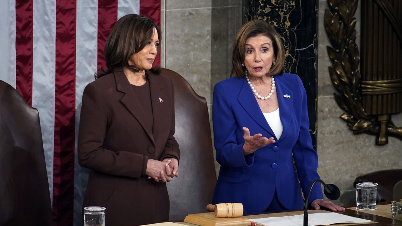 House Speaker Nancy Pelosi of Calif., right, speaks to Vice President Kamala Harris before President Joe Biden arrives to deliver his State of the Union address to a joint session of Congress at the Capitol, Tuesday, March 1, 2022, in Washington. (Al Drago, Pool via AP)