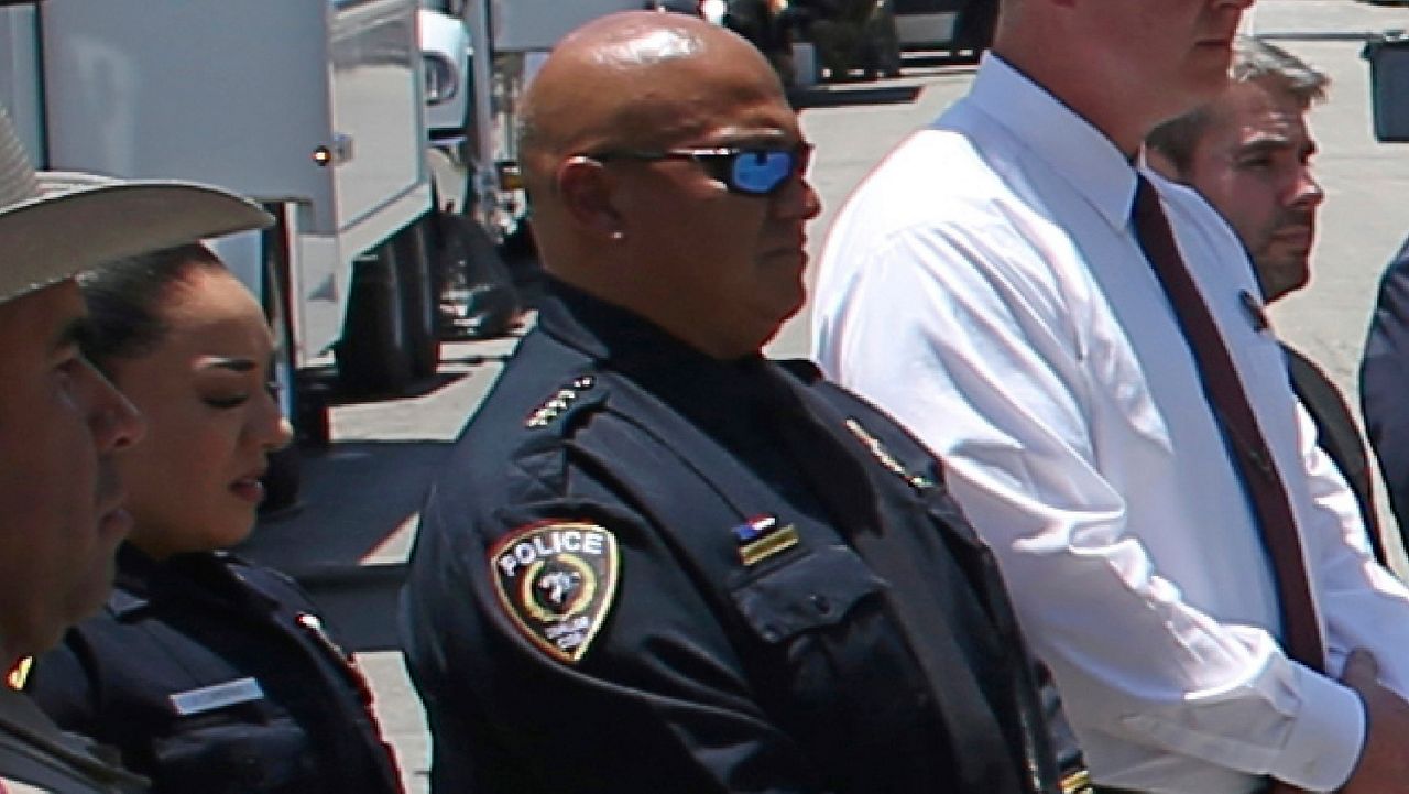 Uvalde School Police Chief Pete Arredondo, third from left, stands during a news conference outside of the Robb Elementary school on May 26, 2022, in Uvalde, Texas. (AP Photo/Dario Lopez-Mills, File)