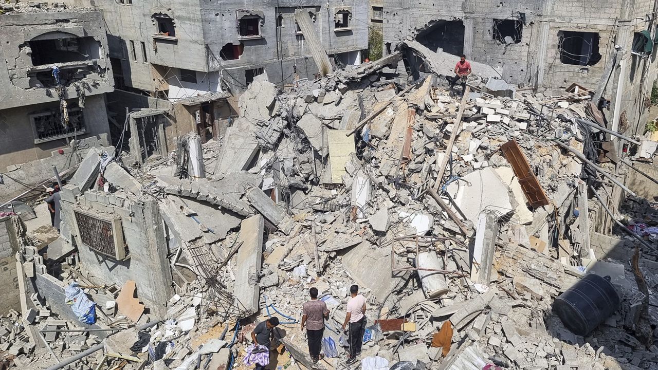 Palestinians look at the destruction after an Israeli airstrike in Rafah, Gaza Strip. Monday, April 29, 2024. (AP Photo/Mohammad Jahjouh)
