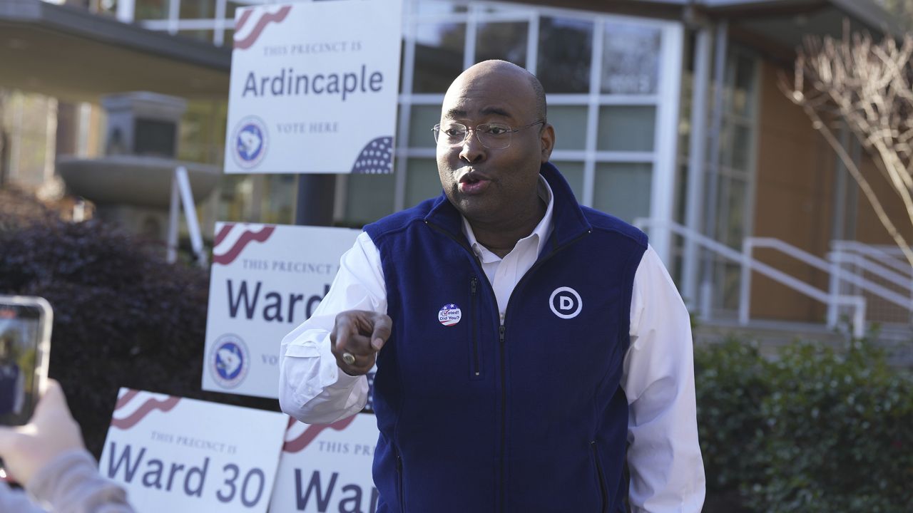 Democratic National Committee Chairman Jaime Harrison films a video encouraging people to vote in South Carolina's lead-off Democratic presidential primary on Saturday, Feb. 3, 2024, in Columbia, S.C. (AP Photo/Meg Kinnard)