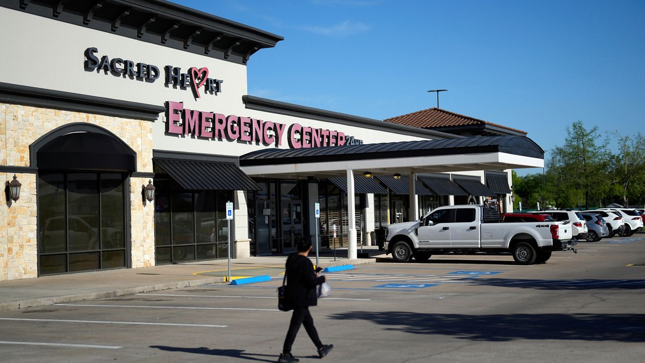 Sacred Heart Emergency Center is pictured Friday, March 29, 2024, in Houston. At Sacred Heart Emergency Center in Houston, front desk staff refused to check-in one woman after her husband asked for help delivering her baby. She miscarried in a restroom toilet in the emergency room lobby while her husband called 911 for help. (AP Photo/David J. Phillip)