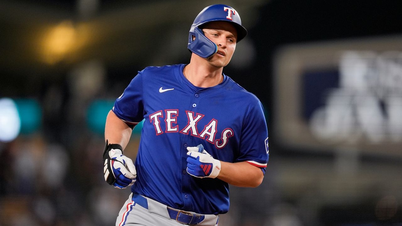 Texas Rangers' Corey Seager runs the bases on a three-run home run against the Los Angeles Dodgers during the fifth inning of a baseball game Wednesday, June 12, 2024, in Los Angeles. (AP Photo/Ryan Sun)