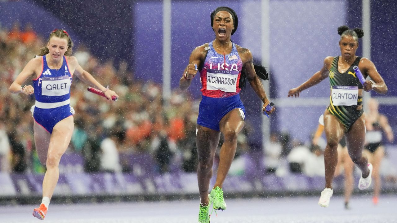 Sha'Carri Richardson 0f the United States, celebrates after winning the women's 4 x 400-meter relay final at the 2024 Summer Olympics, Friday, Aug. 9, 2024, in Saint-Denis, France. (AP Photo/Petr David Josek)