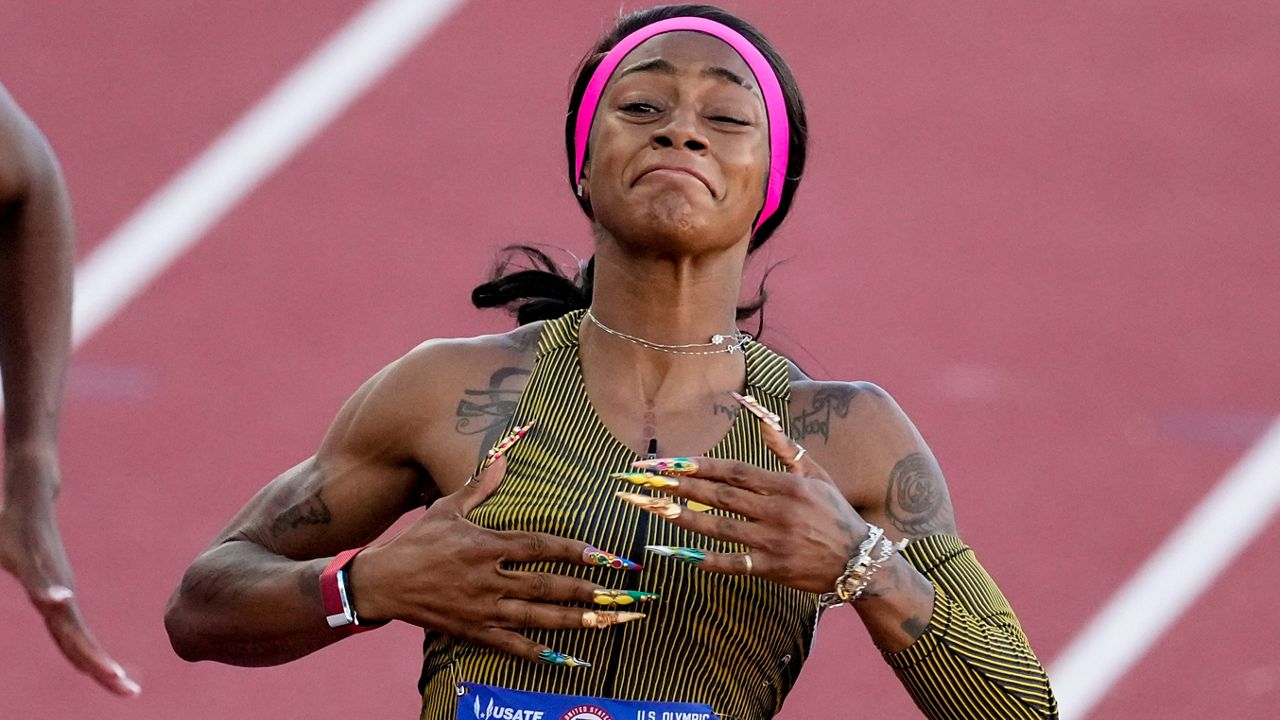 Sha'Carri Richardson celebrates her win in the wins women's 100-meter run final during the U.S. Track and Field Olympic Team Trials Saturday, June 22, 2024, in Eugene, Ore. (AP Photo/Chris Carlson)
