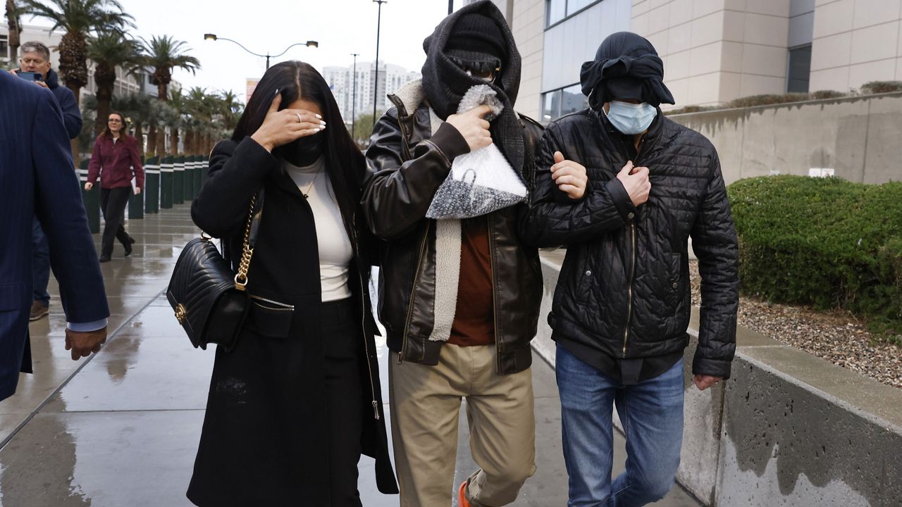 Former FBI informant Alexander Smirnov, center, leaves the courthouse on Tuesday, Feb. 20, 2024, in Las Vegas. (Bizuayehu Tesfaye/Las Vegas Review-Journal via AP)