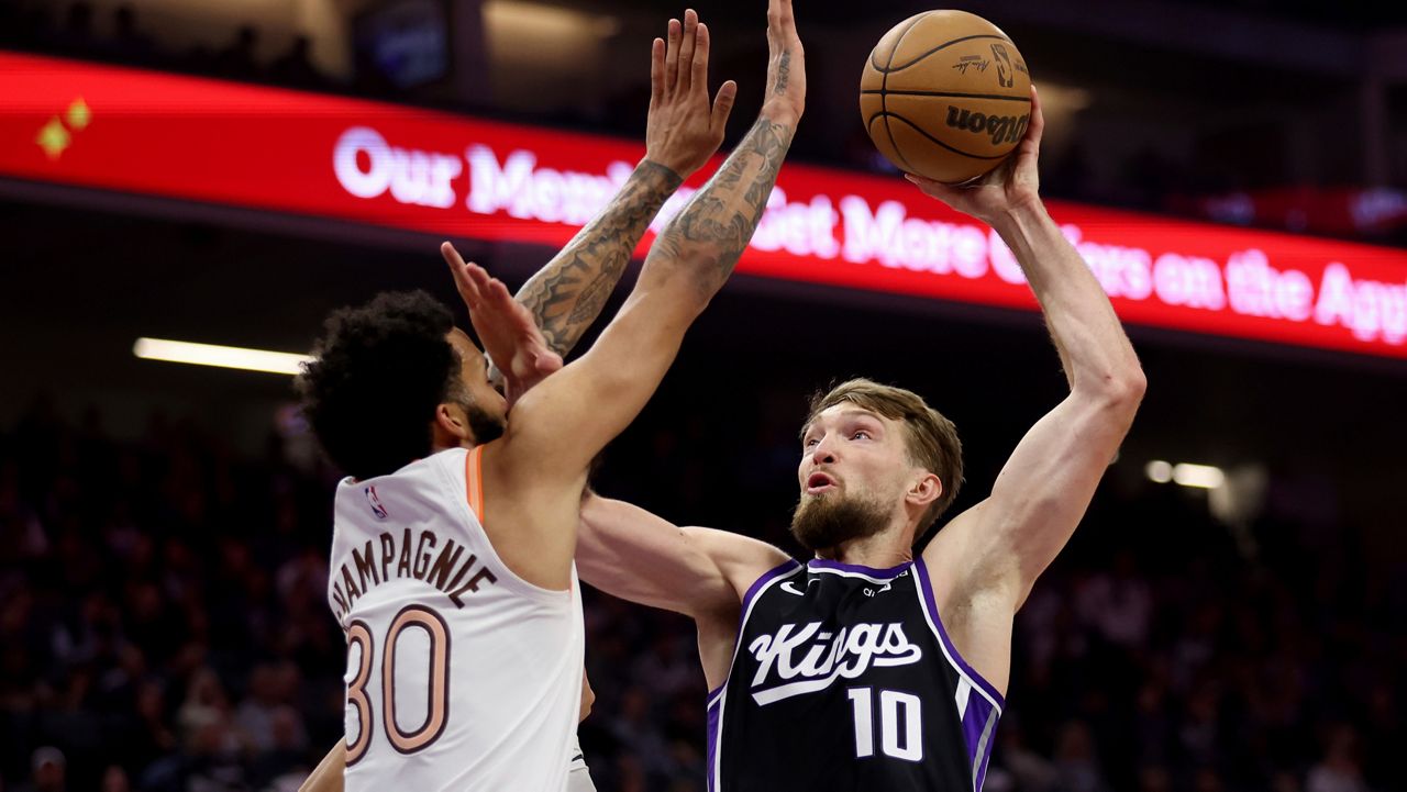 Sacramento Kings forward Domantas Sabonis (10) shoots against San Antonio Spurs forward Julian Champagnie (30) during the first half of an NBA basketball game in Sacramento, Calif, Thursday, March 7, 2024. (AP Photo/Jed Jacobsohn)