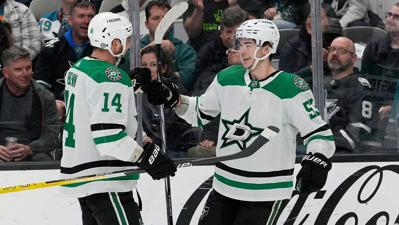 Dallas Stars center Wyatt Johnston, right, is congratulated by left wing Jamie Benn (14) after scoring against the San Jose Sharks during the second period of an NHL hockey game in San Jose, Calif., Tuesday, March 26, 2024. (AP Photo/Jeff Chiu)