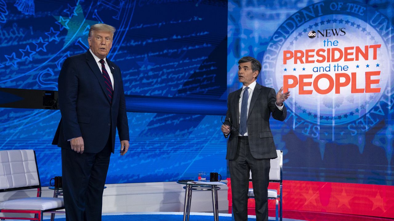 President Donald Trump talks with ABC News anchor George Stephanopoulos before a town hall at National Constitution Center, Tuesday, Sept. 15, 2020, in Philadelphia. (AP Photo/Evan Vucci)