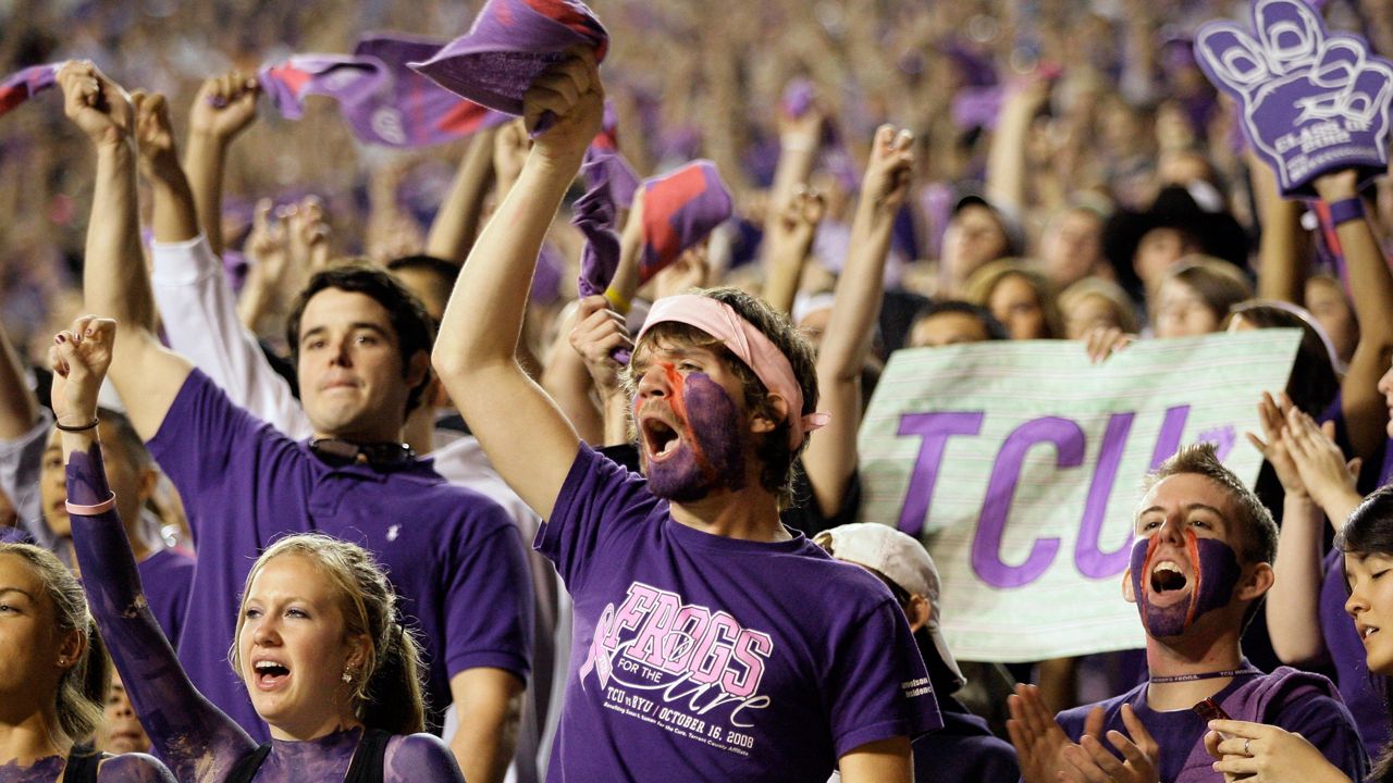 TCU fans cheer during in the first half of an NCAA college football game against Utah in Fort Worth, Texas, Saturday, Nov. 14. 2009. (AP Photo/Donna McWilliam)