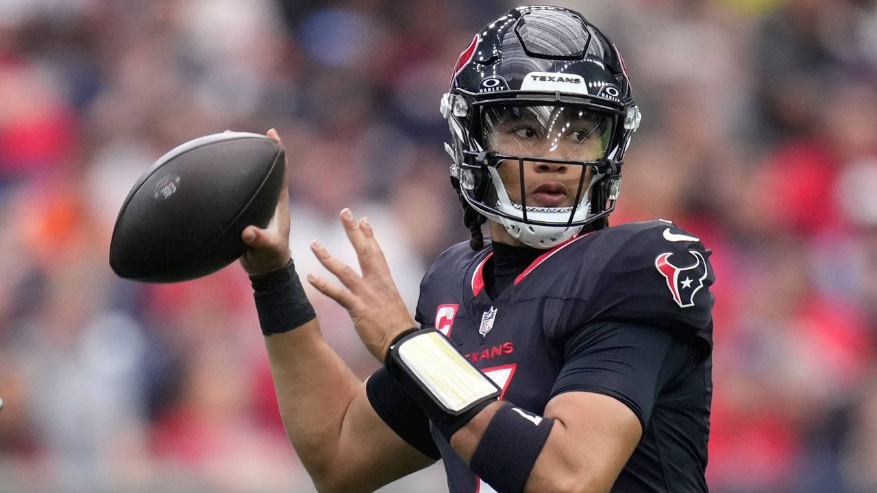 Houston Texans quarterback C.J. Stroud (7) looks to pass during the first half of an NFL football game against the Miami Dolphins, Sunday, Dec. 15, 2024, in Houston. (AP Photo/Eric Christian Smith)