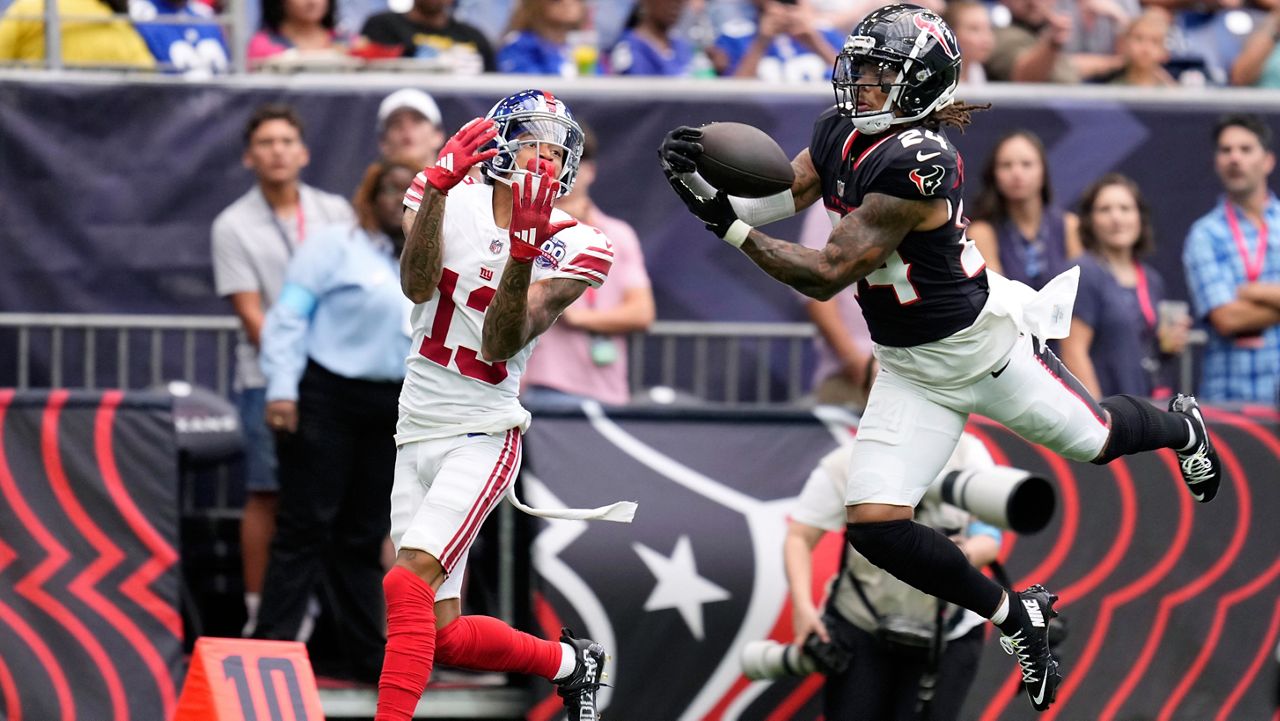 Houston Texans cornerback Derek Stingley Jr. (24) intercepts a pass intended for New York Giants wide receiver Jalin Hyatt (13) that was thrown by quarterback Daniel Jones (8) in the first half of a preseason NFL football game, Saturday, Aug. 17, 2024, in Houston. (AP Photo/Eric Christian Smith)