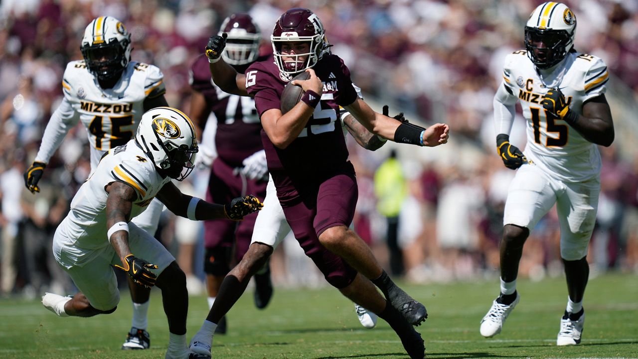 Texas A&M quarterback Conner Weigman (15) runs for a first down against Missouri during the first half of an NCAA college football game Saturday, Oct. 5, 2024, in College Station, Texas. (AP Photo/Eric Gay)