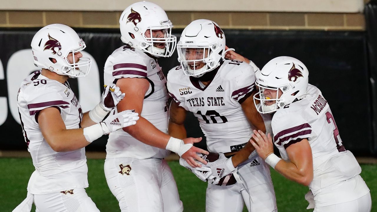 Texas State wide receiver Marcell Barbee (18) celebrates his touchdown with teammates, including quarterback Brady McBride (2), during the second half of an NCAA college football game against Boston College, Saturday, Sept. 26, 2020, in Boston. (AP Photo/Michael Dwyer)