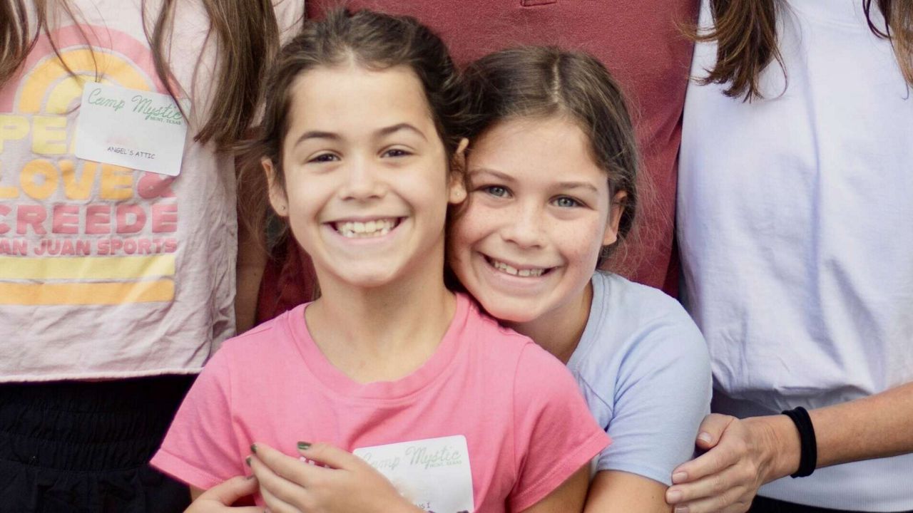 This undated photo provided by John Lawrence on Monday, July 7, 2025, shows twin sisters, Hanna Lawrence, left, and Rebecca Lawrence, right, who were two the victims killed by the flooding at Camp Mystic in central Texas on Friday, July 4. (John Lawrence via AP)